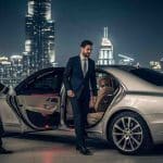 uxury Mercedes-Benz S-Class illuminated with Dubai city