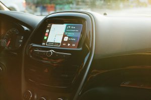 Dubai daily driver hire full day service with chauffeur planning route using Dubai map and GPS inside vehicle